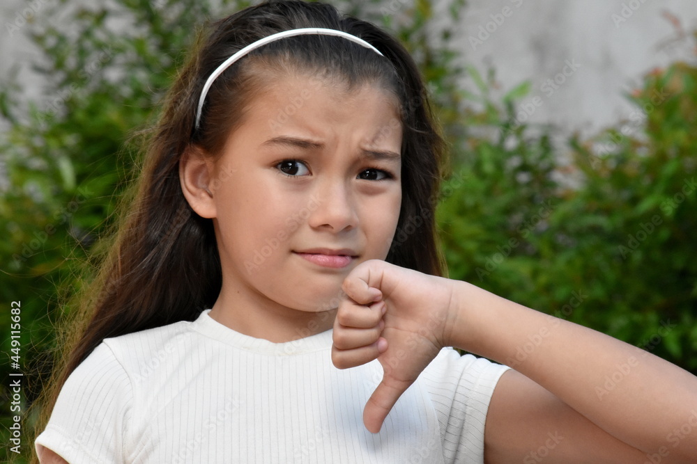 Filipina Female With Thumbs Down Outdoors Filipina Female With Thumbs Down Outdoors
