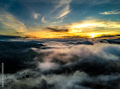 sunset over the foggy mountains