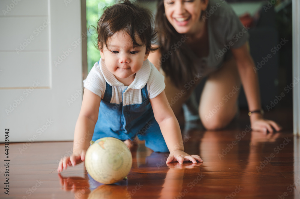 Fototapeta premium young mother are happy to raising new little children at home, woman family with newborn baby who son or daughter, love and care motherhood people, holding small cute girl