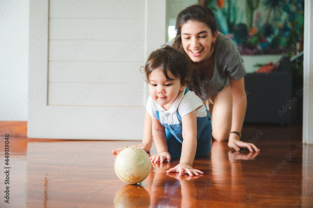 Fototapeta premium young mother are happy to raising new little children at home, woman family with newborn baby who son or daughter, love and care motherhood people, holding small cute girl