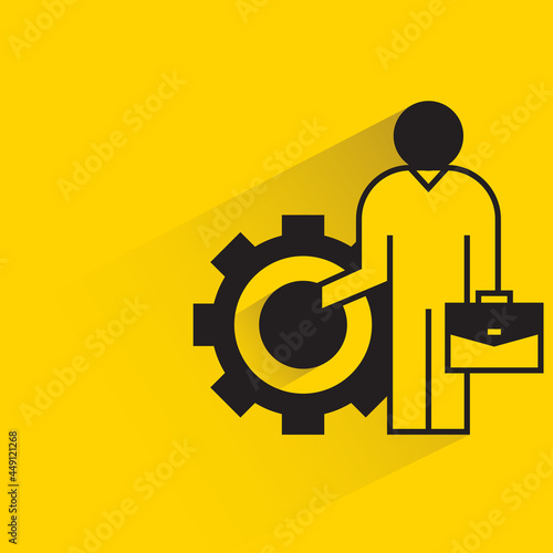 office worker and gear icon on yellow background