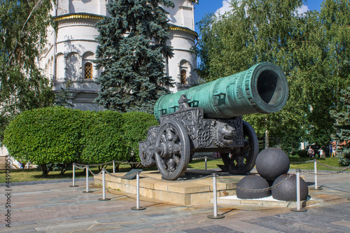 MOSCOW, RUSSIA-AUGUST, 4, 2021: a large bronze tsar cannon and cannonballs on Sobornaya Square in the Kremlin on a sunny summer day