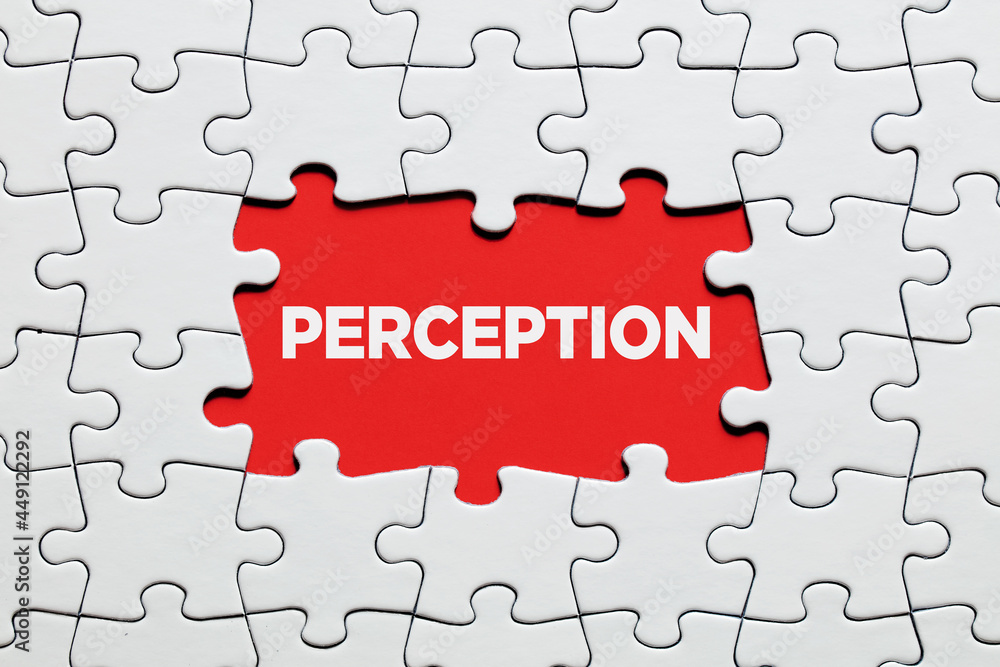 Fototapeta premium The word perception surrounded by jigsaw puzzle. To increase or expand the realm of perception.