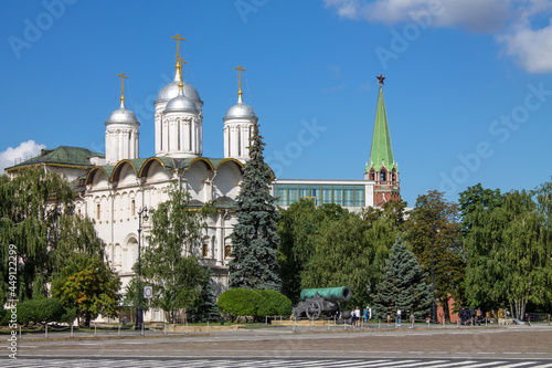 Photography the white-stone Cathedral of the Twelve Apostles among the green foliage of tree