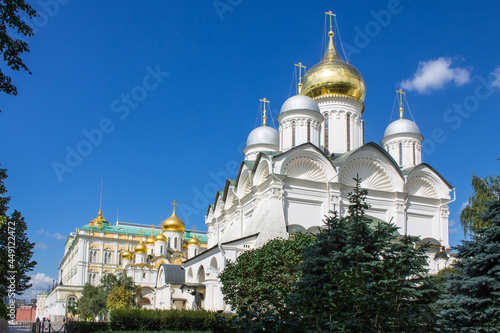 The Archangel Cathedral in the Kremlin with golden domes shining in the sun on a clear summer day in Moscow Russia