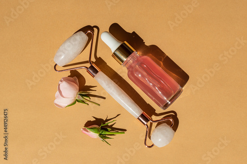 Wallpaper Mural Massage quartz roller for the face of pink natural nephritis with beauty serum or rose essential oil. Skin care facial massage and relaxation. Home massage tools. Anti age and lifting procedures Torontodigital.ca