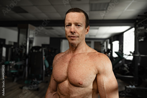 Portrait of a senior muscular man in a gym