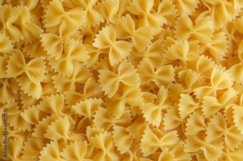 Closeup dry macaroni background. Textured kitchen background