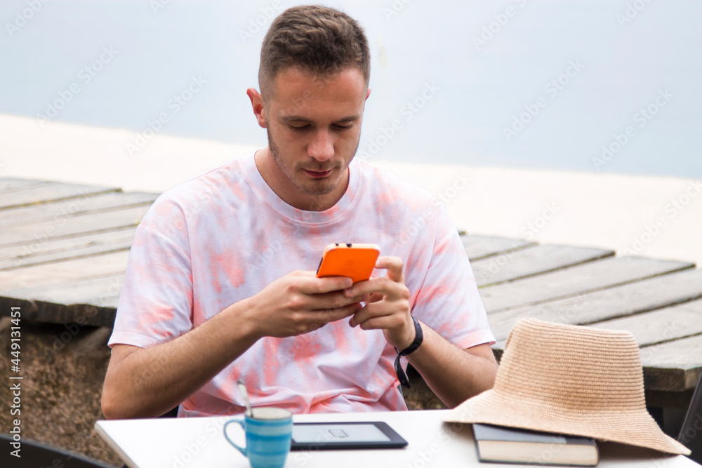 young man using mobile phone outdoors