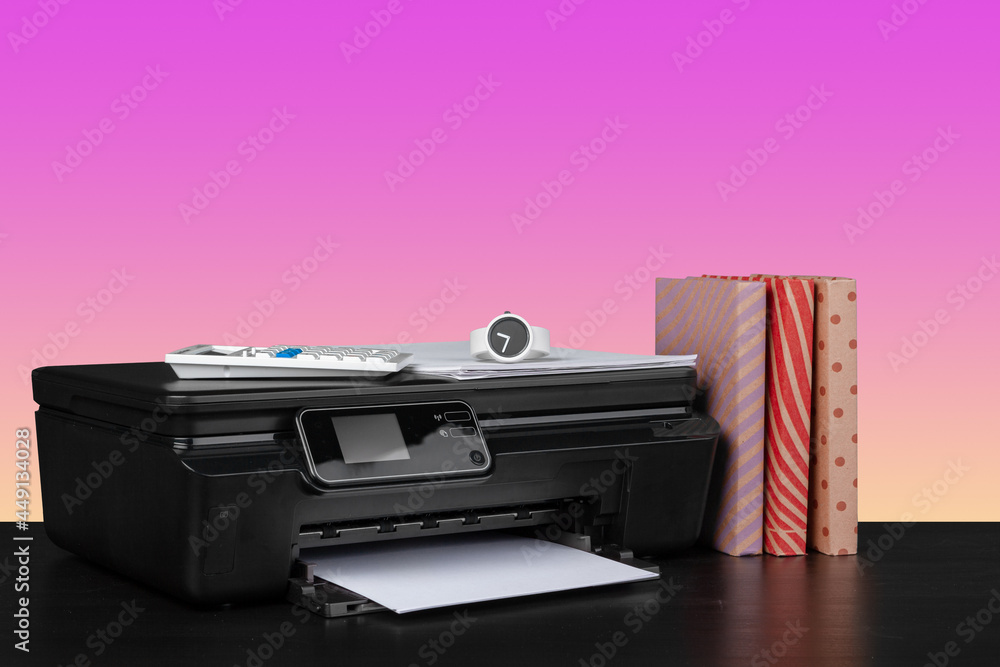 Compact home laser printer against pink background Compact home laser printer against pink background