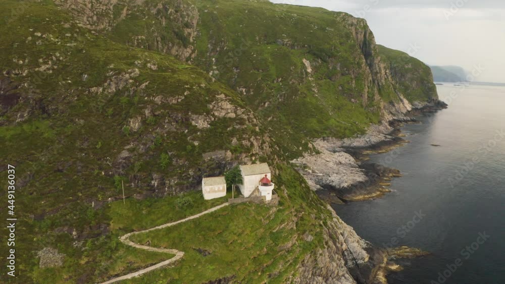 Top View Of Hendanes Lighthouse in Vagsvag region near Maloy at the coast of Norway - aerial shot Top View Of Hendanes Lighthouse in Vagsvag region near Maloy at the coast of Norway - aerial shot