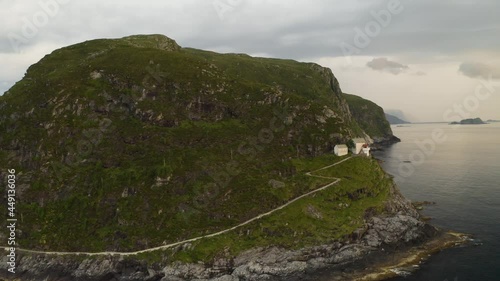 Scenic View Of Hendanes Lighthouse On The Western Shore Of The Island Of Vagsoy In Norway - aerial shot photo