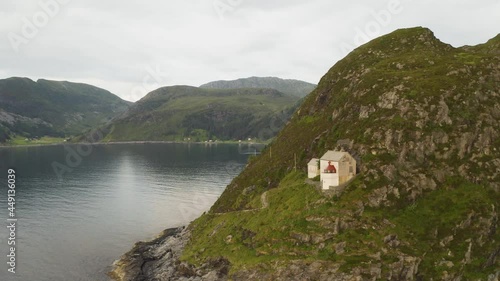 Hendanes Lighthouse In Vagsvag Region In Norway - aerial drone shot photo