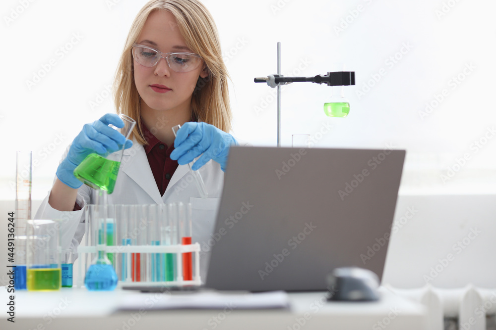 Technician hold in arms in protective gloves Technician hold in arms in protective gloves