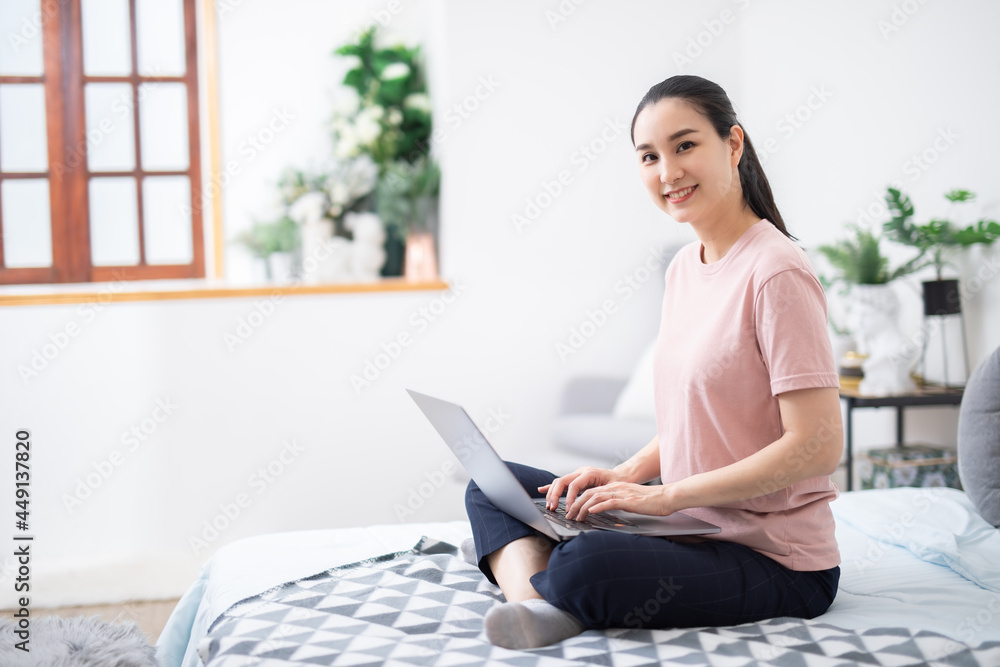 Beautiful asian girl using notebook in a desk at home,work from home concenpt. Beautiful asian girl using notebook in a desk at home,work from home concenpt.
