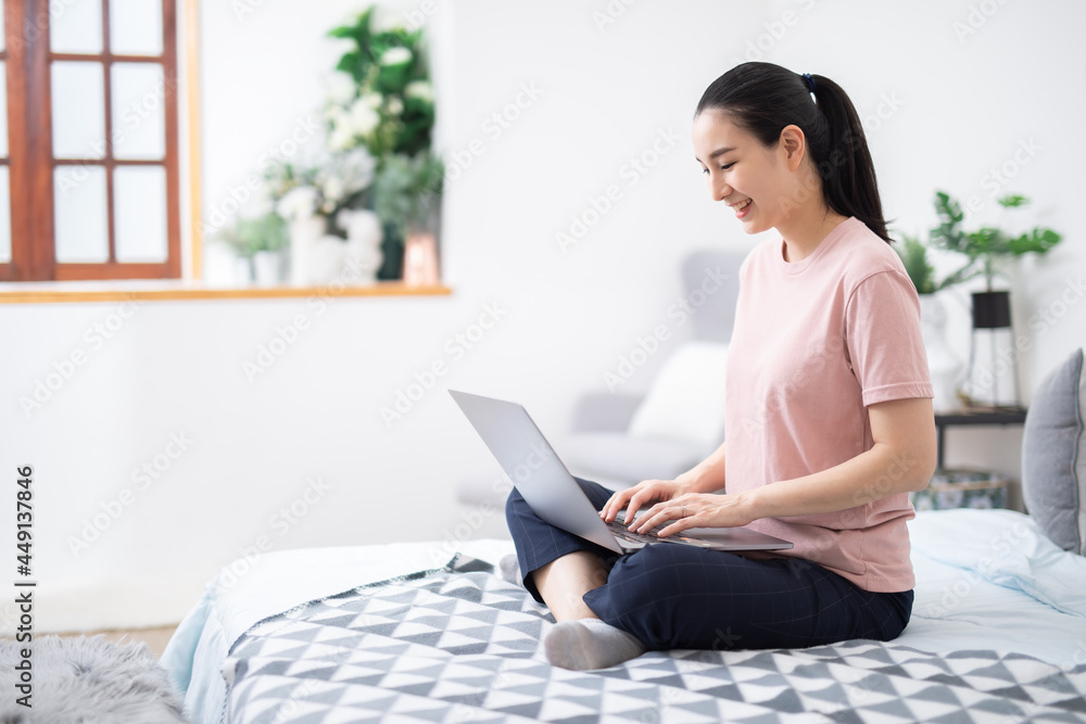 Beautiful asian girl using notebook in a desk at home,work from home concenpt. Beautiful asian girl using notebook in a desk at home,work from home concenpt.