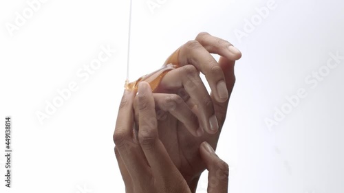 Honey poured on hands, rubbing in