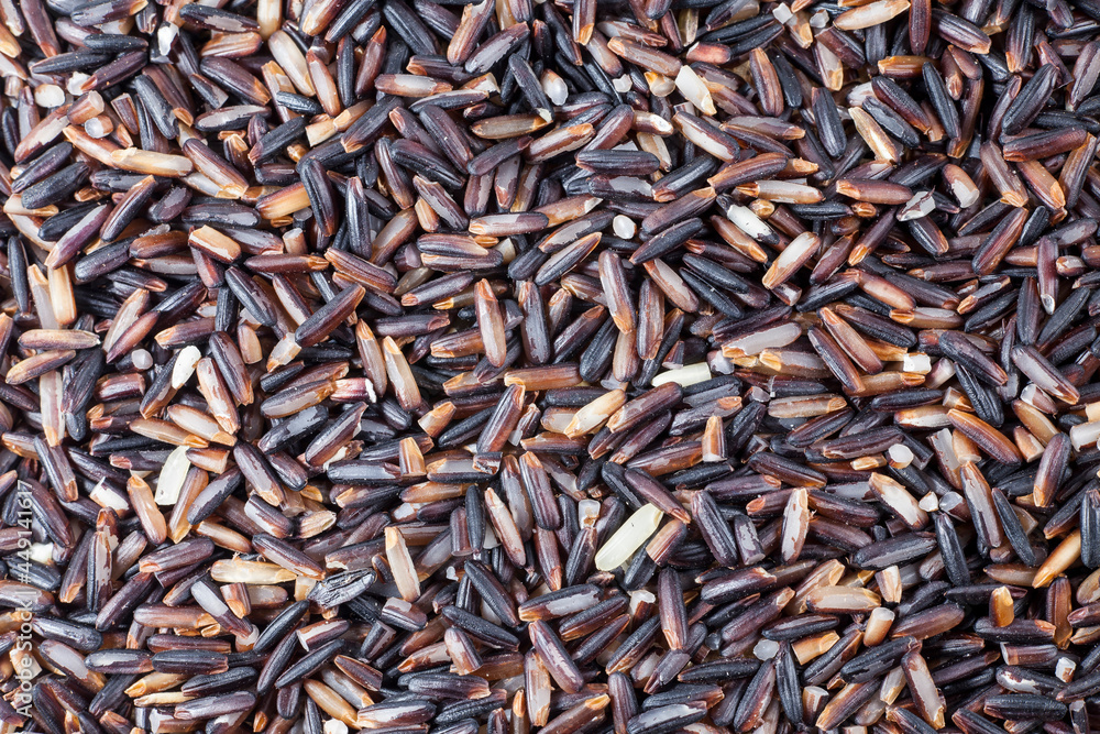 Black rice berries background.