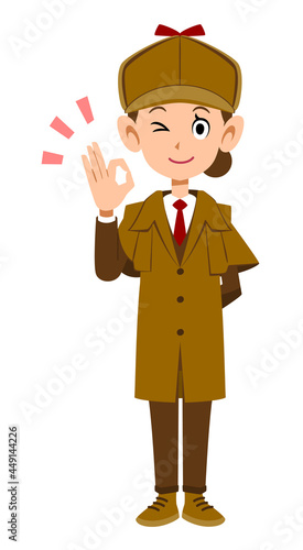 OKのハンドサインを示す女性の探偵の全身
