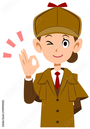 OKのハンドサインを示す女性の探偵の上半身
