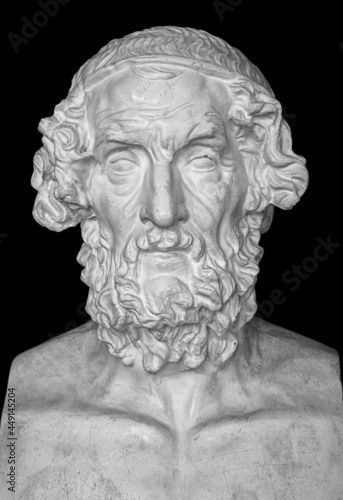 Gypsum copy of ancient statue Homer head on dark textured background. Plaster sculpture man face