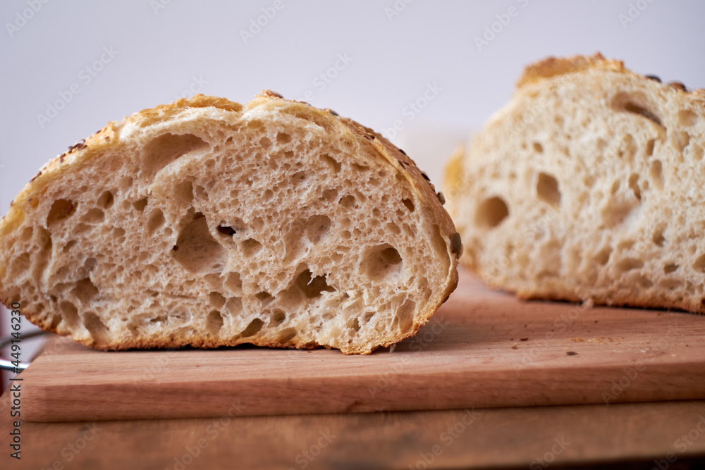 homemade bread. The sourdough bread. Side View. Wooden and white background. rustic.