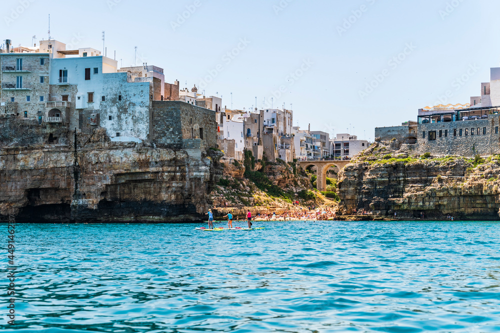 Polignano a Mare seen from the sea. Cliffs and caves