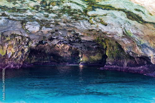 Polignano a Mare seen from the sea. Cliffs and caves