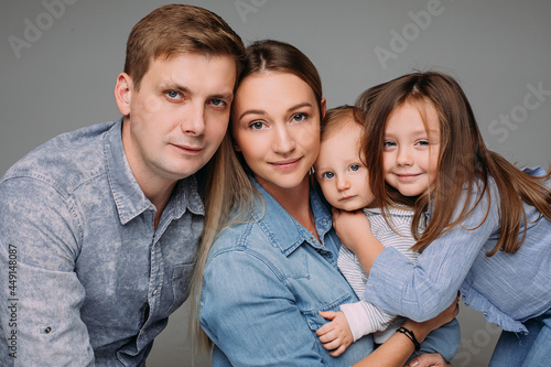 Beautiful family photo in blue color clothes