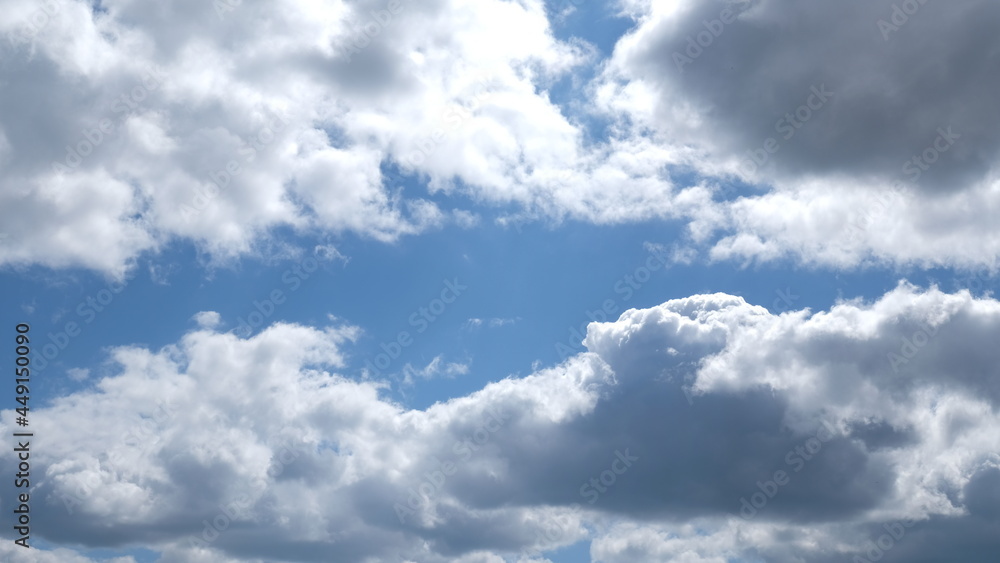Frame of Beautiful blue sky with clouds background. Sky clouds. Air and fluffy clouds in the blue sky on a sunny day, background texture. Copy space. The concept of hope. Frame of Beautiful blue sky with clouds background. Sky clouds. Air and fluffy clouds in the blue sky on a sunny day, background texture. Copy space. The concept of hope.