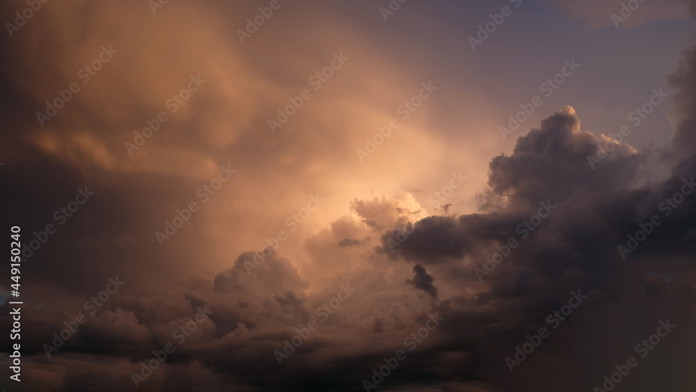 Bright purple and pink sky with clouds of a sunset or sunrise background. Twilight sky background with Colorful sky. Dramatic sky. Аir and fluffy clouds as a concept of hope. Bright purple and pink sky with clouds of a sunset or sunrise background. Twilight sky background with Colorful sky. Dramatic sky. Аir and fluffy clouds as a concept of hope.