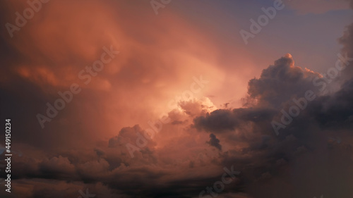 Bright purple and pink sky with clouds of a sunset or sunrise background. Twilight sky background with Colorful sky. Dramatic sky. Аir and fluffy clouds as a concept of hope. © Yuliya