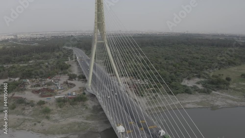 An aerial shot of the Signature Bridge with cars moving in New Delhi, India photo