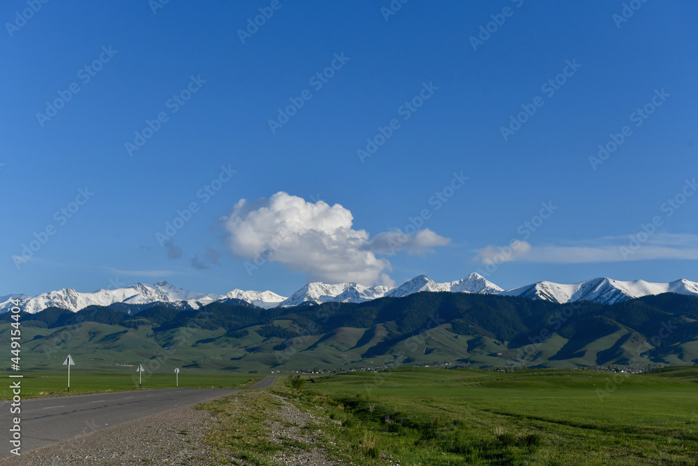 Mountain landscape with clouds and road, Kazakhstan, Almaty region