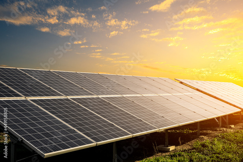 Solar power panels and beautiful natural landscape at sunset in summer in China