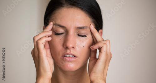 Wallpaper Mural A businesswoman with a headache holding head Torontodigital.ca