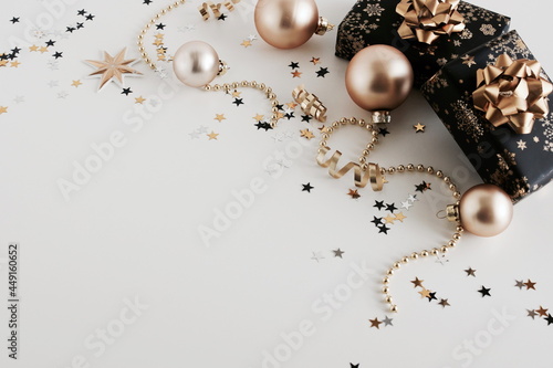 Christmas background . New Year decorations in gold colors on beige  backgrou...