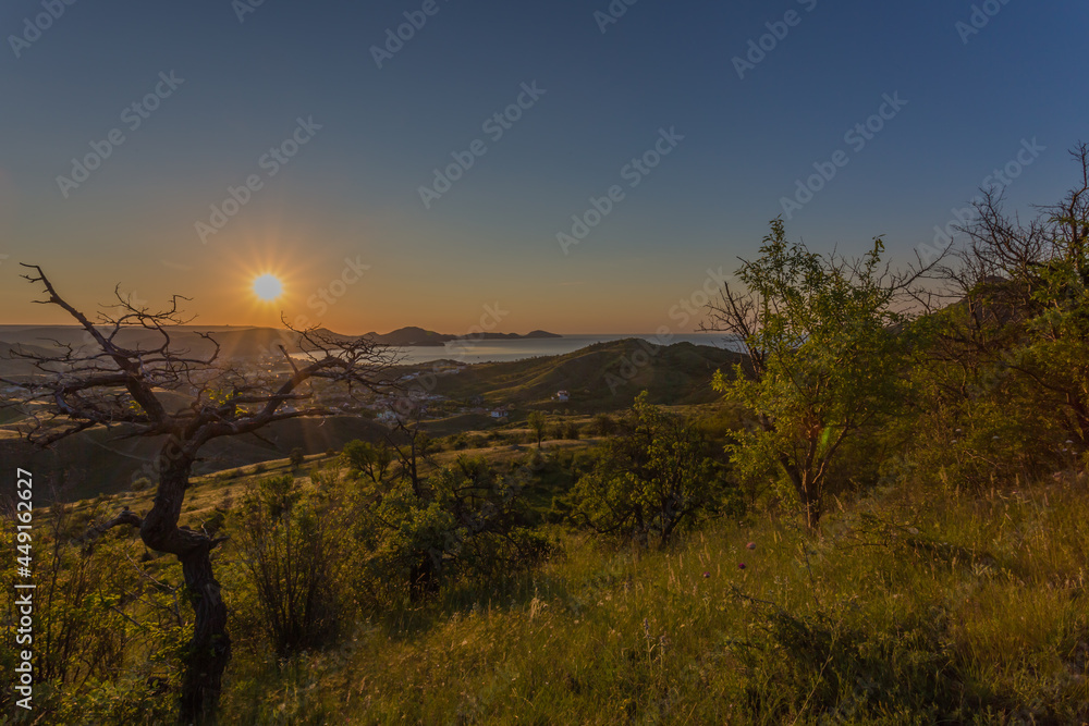 A beautiful village on the Black Sea coast of Koktebel. Unforgettable sunrises and sunsets in summer in the Crimea.