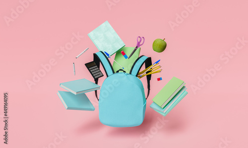 school supplies floating with blue backpack and red pastel background photo