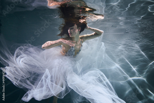 Woman in the water in white dress