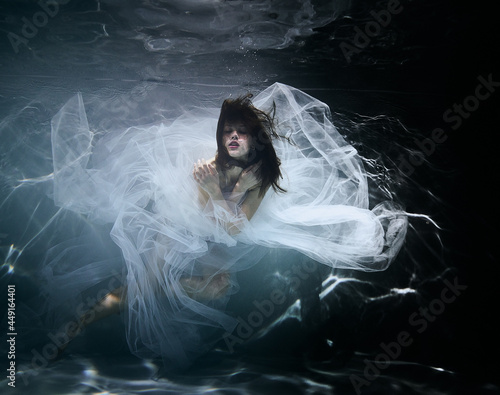Woman in the water in white dress