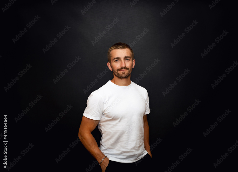 handsome and smiling guy on a black background handsome and smiling guy on a black background