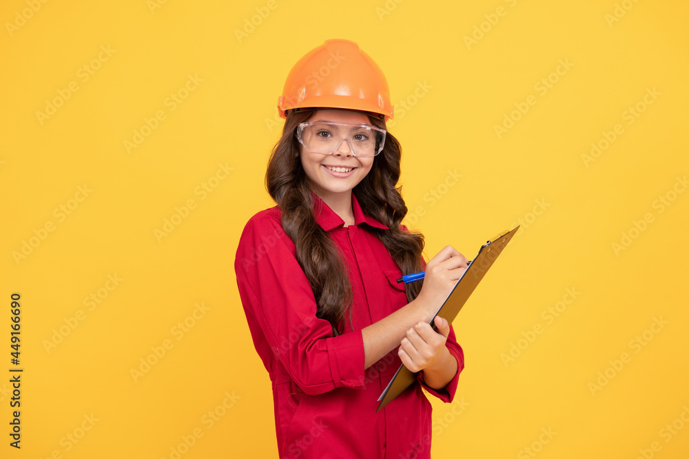 reporting concept. making notes. child wear eyeglasses and helmet. protection. make notes in folder reporting concept. making notes. child wear eyeglasses and helmet. protection. make notes in folder
