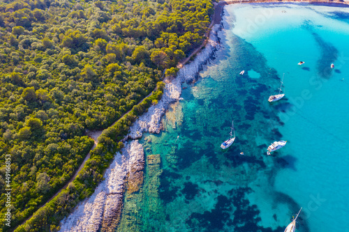 Aerial view of sailing boats in a beautiful azure turquoise lagoon on Sakarun beach bay on Dugi Otok island, Croatia, beautiful seascape © Mislav