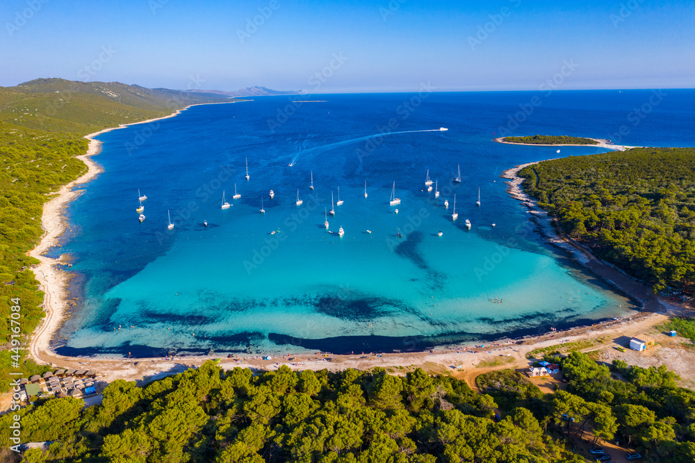 Aerial view of sailing boats in a beautiful azure turquoise lagoon on Sakarun beach bay on Dugi Otok island, Croatia, beautiful seascape