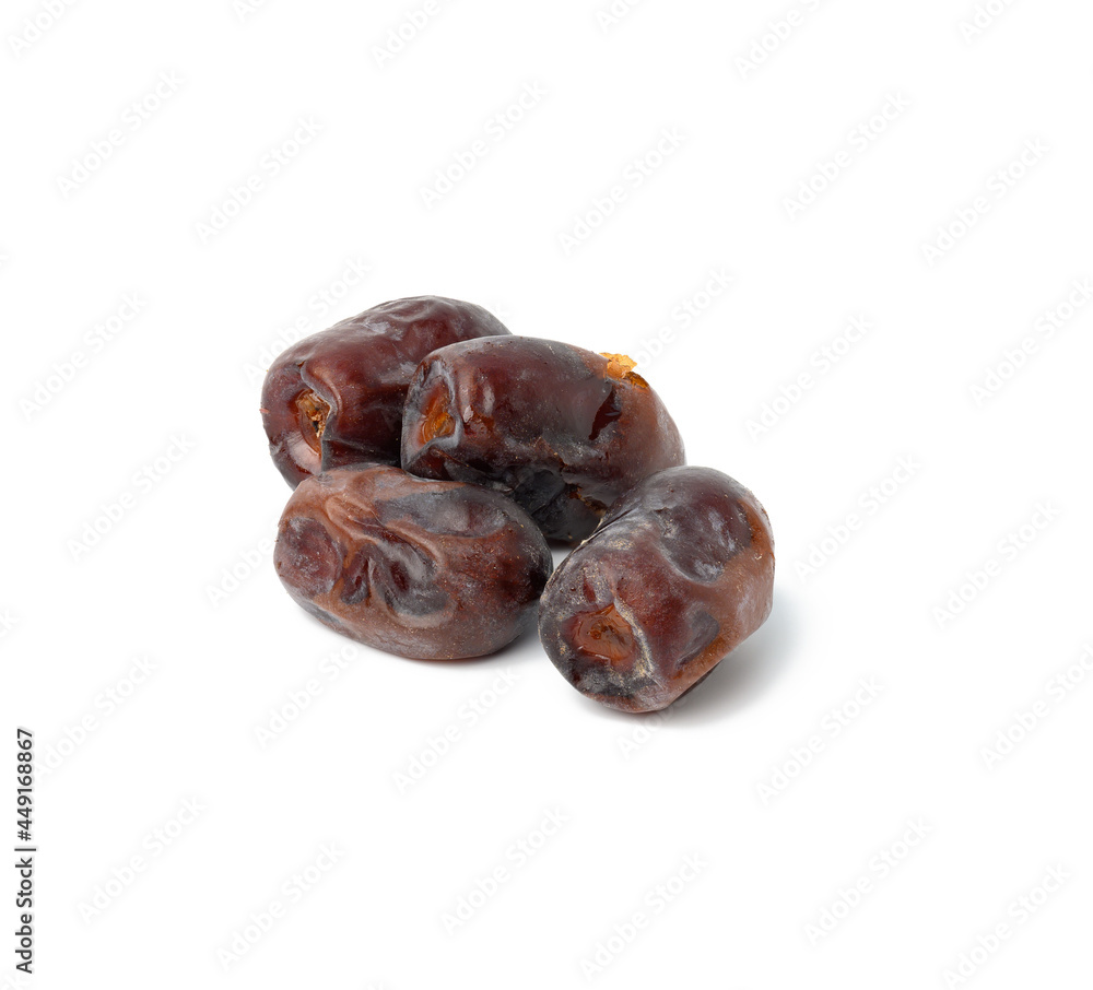 A pile of dried dates on a white background, grade Mazafati A pile of dried dates on a white background, grade Mazafati