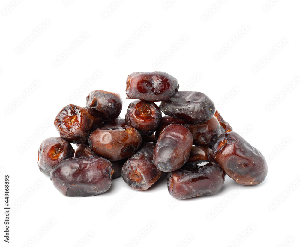 pile of dried dates on a white background, grade Mazafati, close up pile of dried dates on a white background, grade Mazafati, close up
