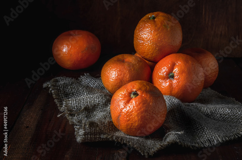 tangerines in bulk on a coarse fabric