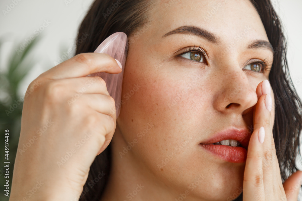 Beautiful woman using Natural Gouache Scraper Massager Beautiful woman using Natural Gouache Scraper Massager