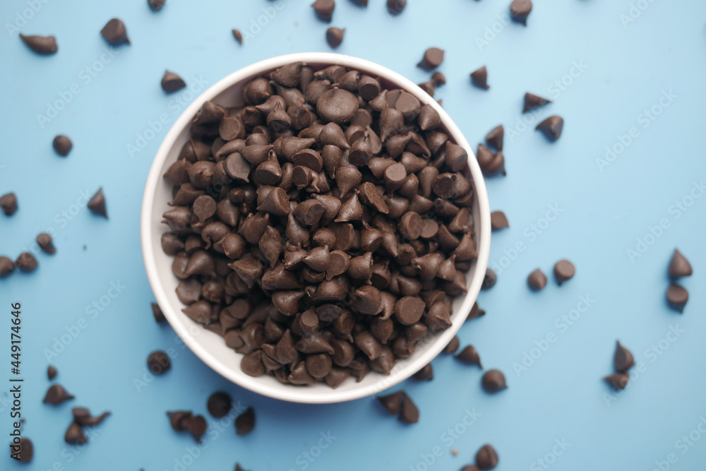 Chocolate chips spilling from a plastic packet, Chocolate chips spilling from a plastic packet,